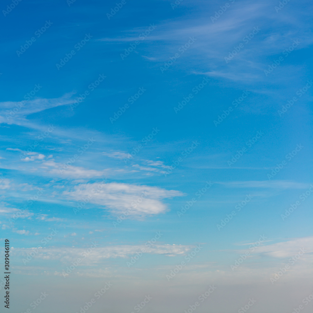 Fototapeta premium Fantastic clouds against blue sky, square