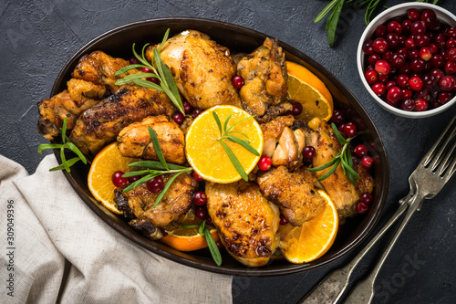 Baked chicken with orange, cranberry and rosemary.