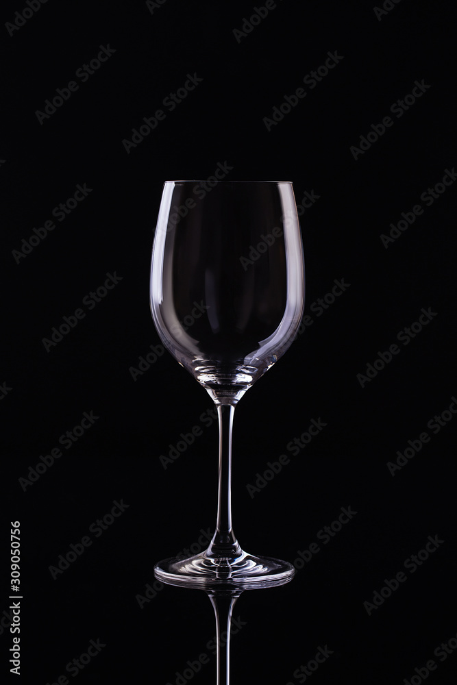 Empty Glass for wine on black background. Empty Glass of wine on black background. Wine on the dark