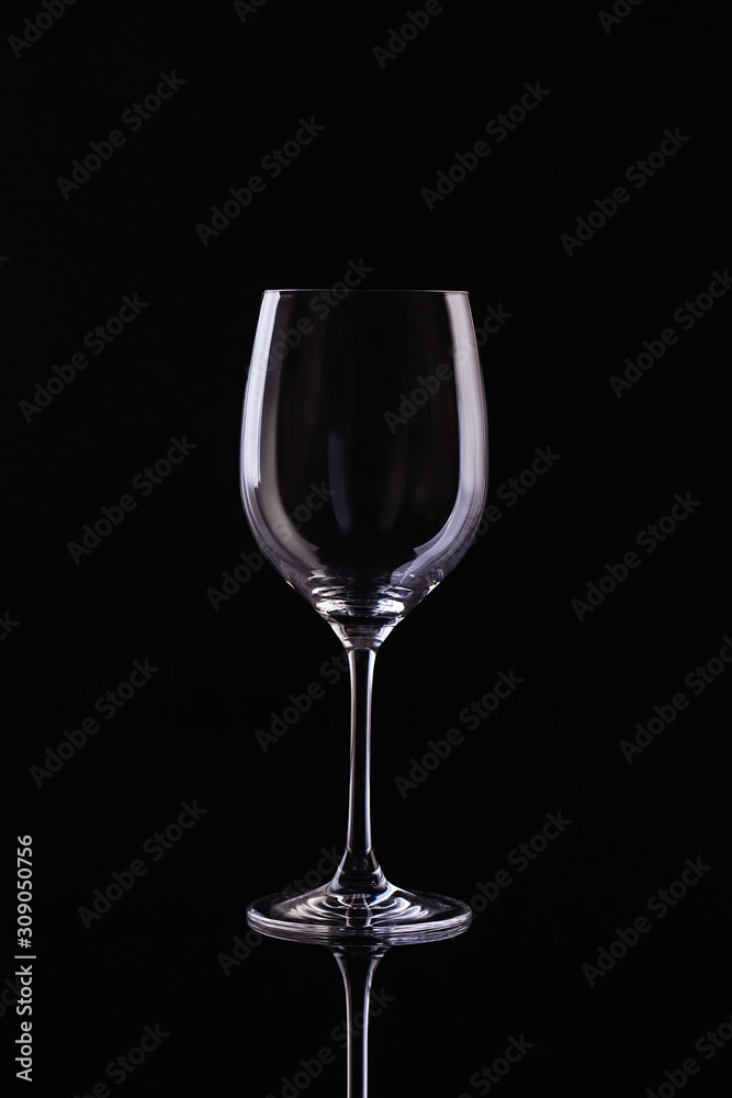 Empty Glass for wine on black background. Empty Glass of wine on black background. Wine on the dark Empty Glass for wine on black background. Empty Glass of wine on black background. Wine on the dark