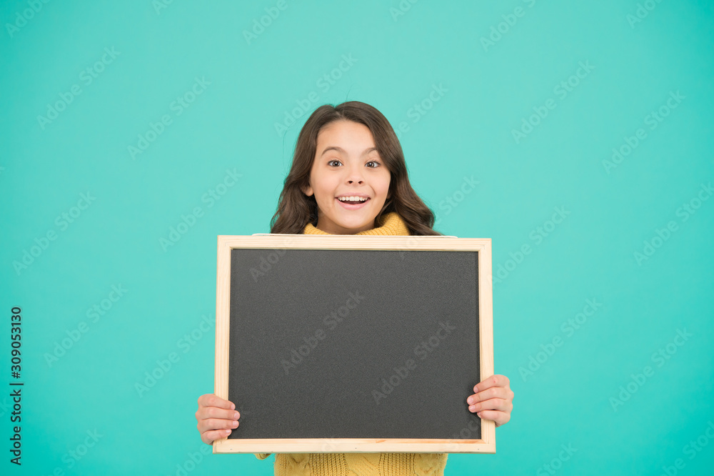 Read this notification. Informing about event. Cute schoolgirl with blackboard. Advertisement. Notification concept. Little girl hold blank chalkboard place for notification. Notice information Read this notification. Informing about event. Cute schoolgirl with blackboard. Advertisement. Notification concept. Little girl hold blank chalkboard place for notification. Notice information