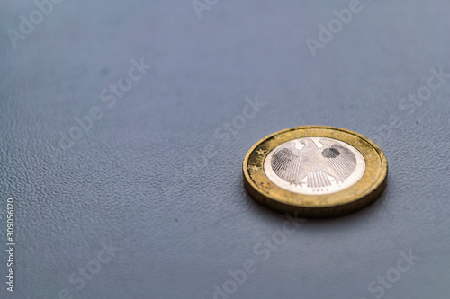 Several euro coins on light blurred background. Closeup photo