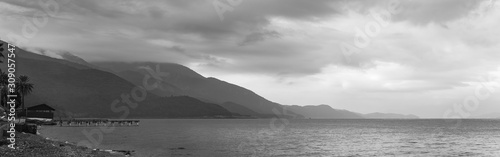 A gloomy sky over the sea as a background. Panoramic sea view suitable for dr...