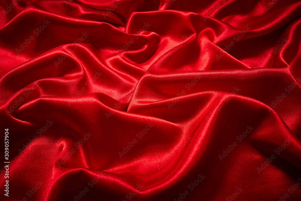 Luxury red satin smooth fabric background for celebration, ceremony, event invitation card or advertising poster Luxury red satin smooth fabric background for celebration, ceremony, event invitation card or advertising poster