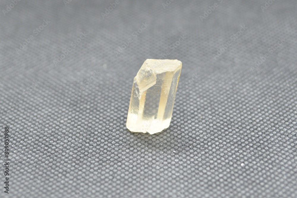Natural quartz crystal on a black background. Natural quartz crystal on a black background.