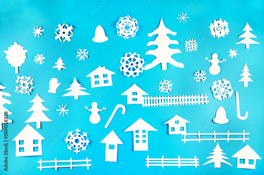 Christmas theme figures made of white paper on blue background