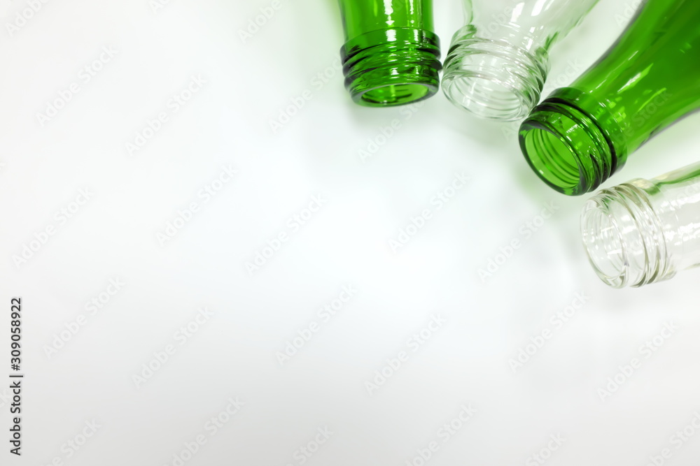 Fototapeta premium Recycled glass bottles in white background showing plastic free concept