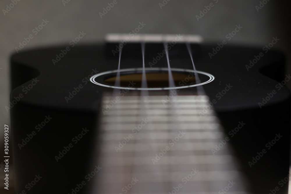 Fototapeta premium ukulele close up on black background