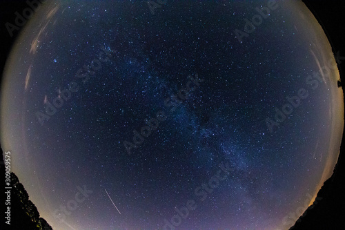 Starry Sky with the Milky Way as seen trough a fish eye lens with light pollution at the edges, Drenthe, The Netherlands
