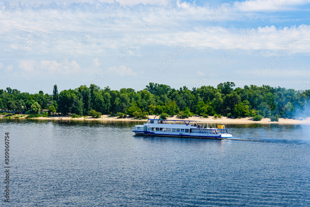 Tourist motor boat on a river Dnieper in Kiev, Ukraine Tourist motor boat on a river Dnieper in Kiev, Ukraine