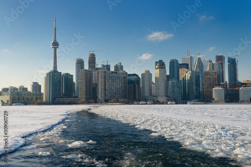 Photography Toronto city skyline with ice breaking path of Wards Island Ferry on frozen Lake