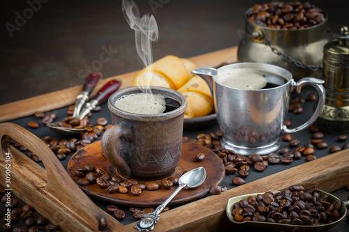 Black coffee on an old background in a cup