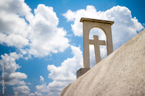 A cross against cloudy skies photo