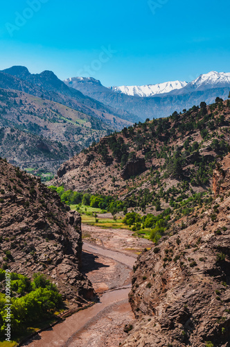 View of the high snow-capped mountains in the Atlas Mountains in Morocco photo