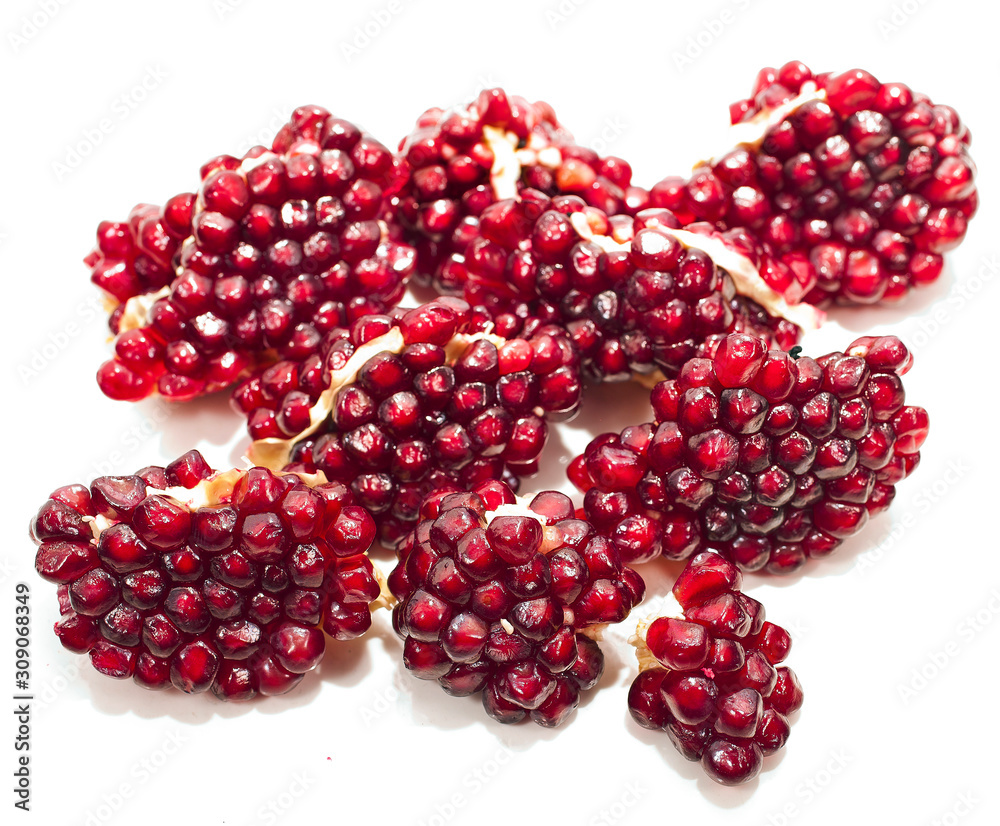 Pieces of pomegranate isolated on a white background. Pieces of pomegranate isolated on a white background.