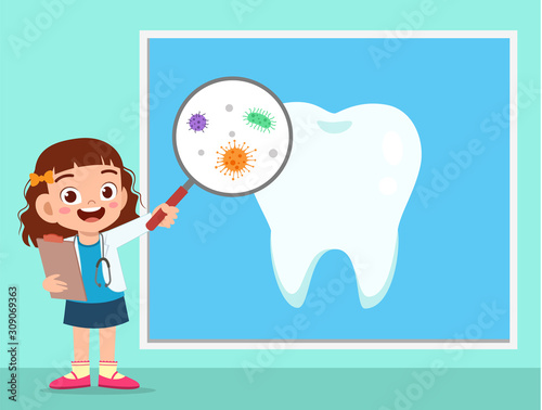 happy cute kid girl using dentist uniform