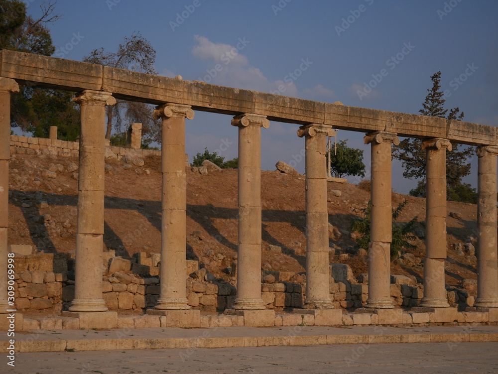 Pillars of roman ruins in the historic city of Jerash, Jordan, landscape of constructions build with columns Pillars of roman ruins in the historic city of Jerash, Jordan, landscape of constructions build with columns