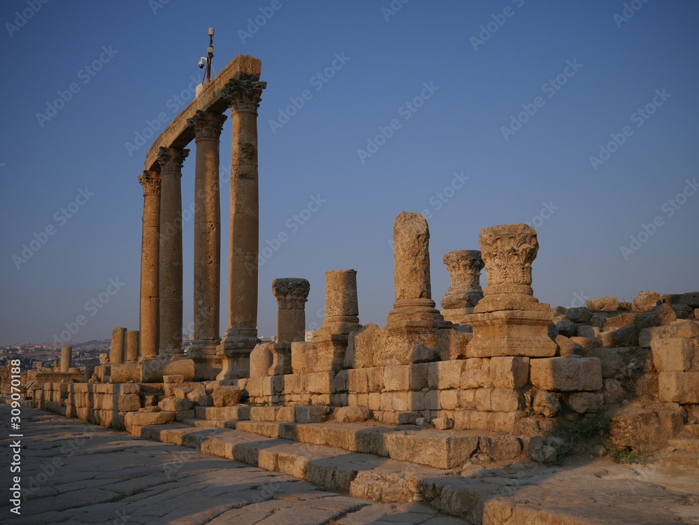 Fototapeta premium Pillars of roman ruins in the historic city of Jerash, Jordan, landscape of constructions build with columns