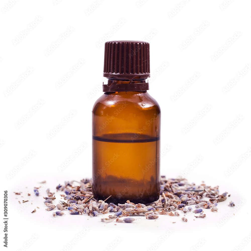Dried lavender flowers and lavender oil in a glass bottle isolated on a white background. Dried lavender flowers and lavender oil in a glass bottle isolated on a white background.