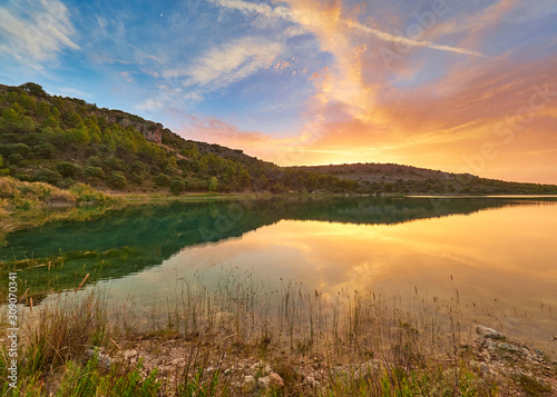 Landscape view of the sunset in the Laguna La Lengua Lake of the Lagunas de Ruidera Lakes Natural Park  Albacete province  Castilla la Mancha  Spain 