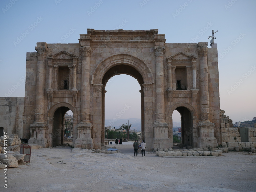 Majestic ruins of a Roman city gate in the historic city of Jerash, Jordan