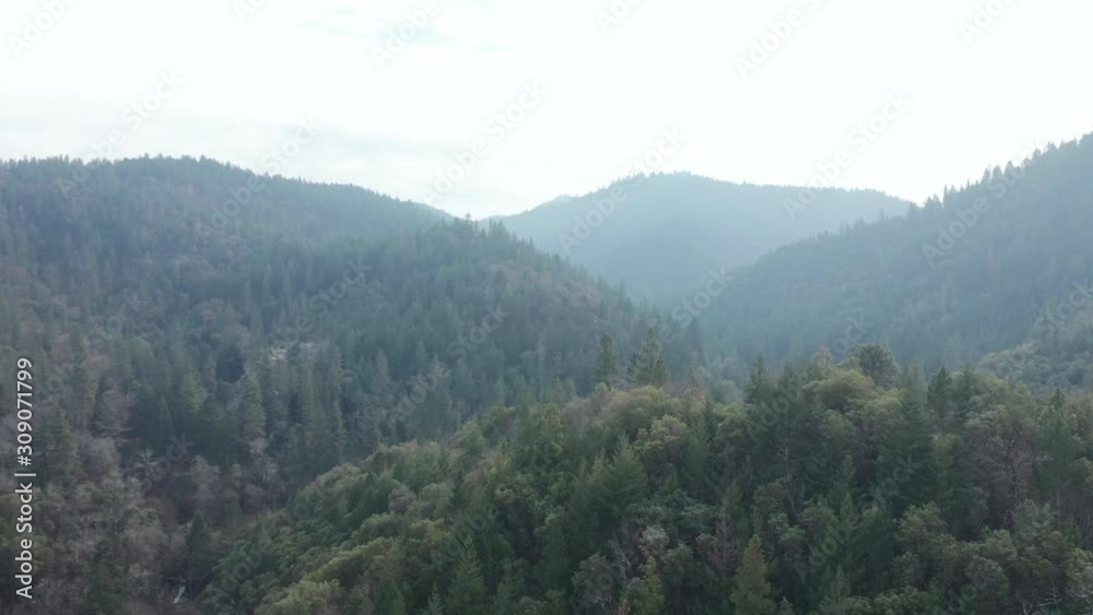 4k Aerial Scenic View Flying Over a Hill with Majestic Mountains as Background 4k Aerial Scenic View Flying Over a Hill with Majestic Mountains as Background