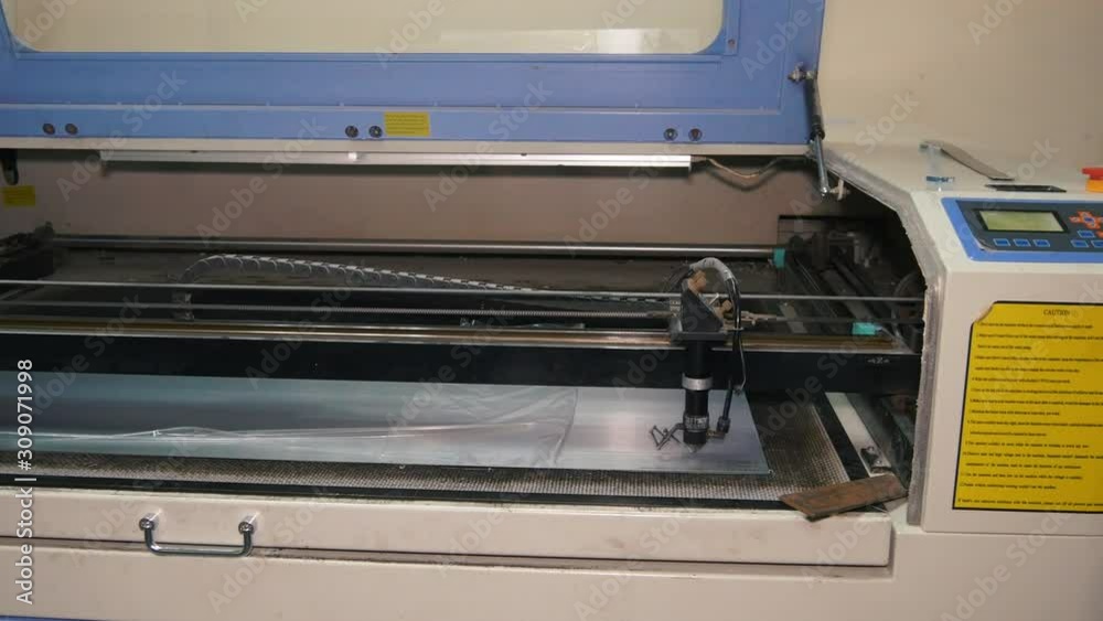 Laser Cutting Machine At Work. Close-up Laser Cutting Machine At Work. Close-up