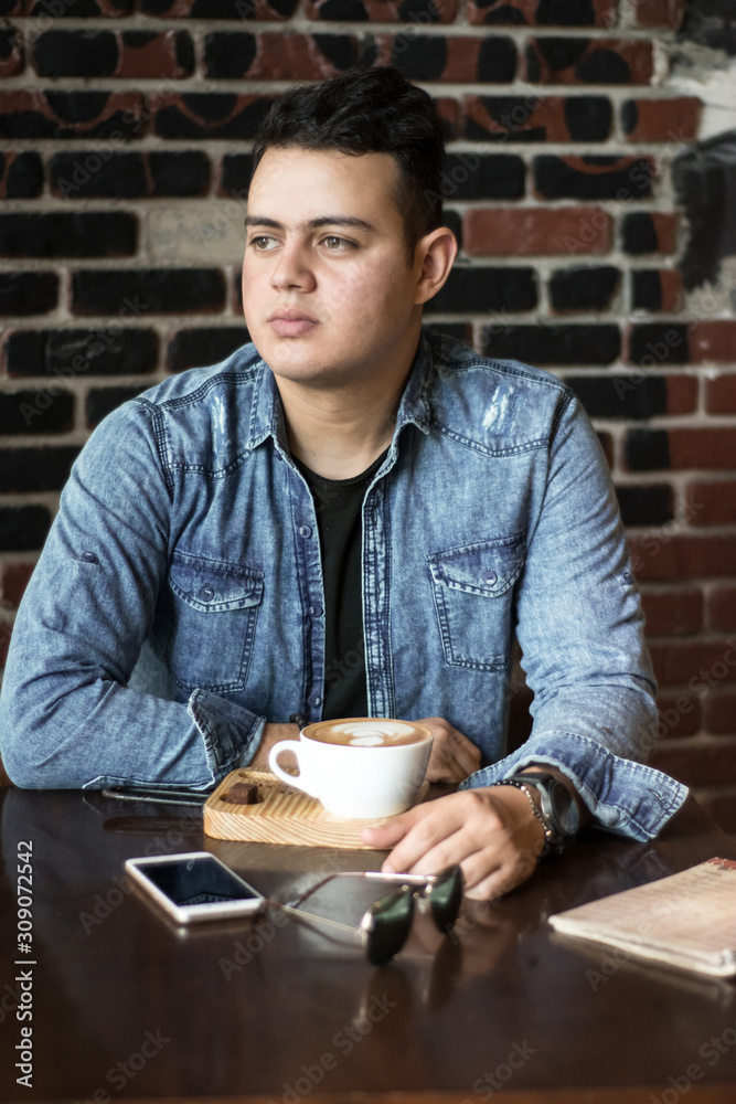 young man in a coffee shop young man in a coffee shop