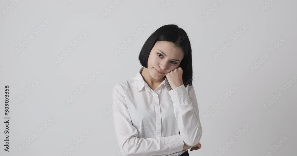 Bored young woman in thoughts over white background Bored young woman in thoughts over white background