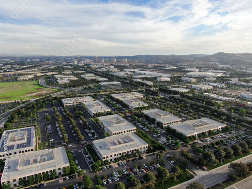 Aerial view of business and finance district with new office building surrounded by parking and road. Irvine Business Complex. Irvine California. USA