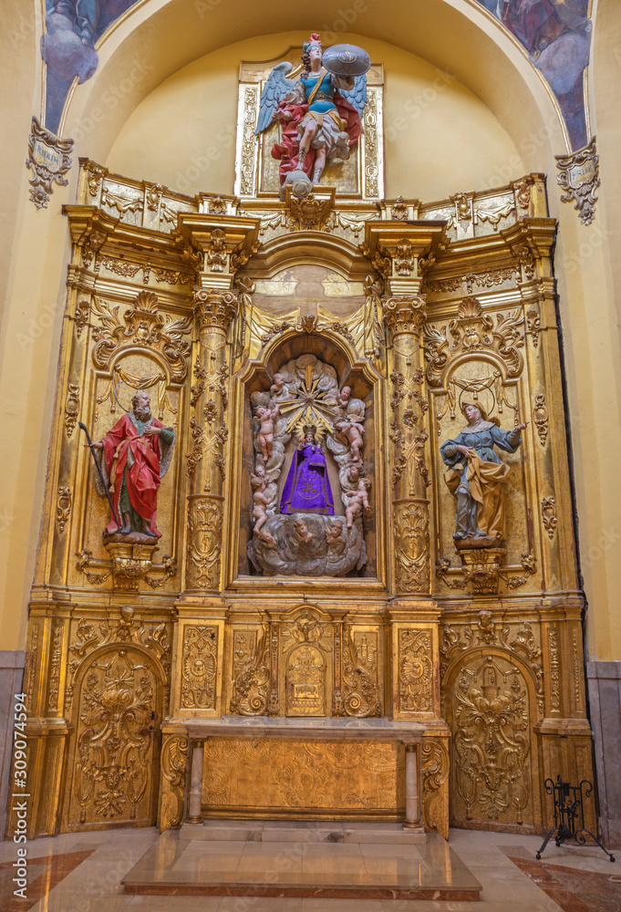 ZARAGOZA, SPAIN - MARCH 3, 2018: The polychome carved broque side altar in church  Iglesia de San Miguel de los Navarros.