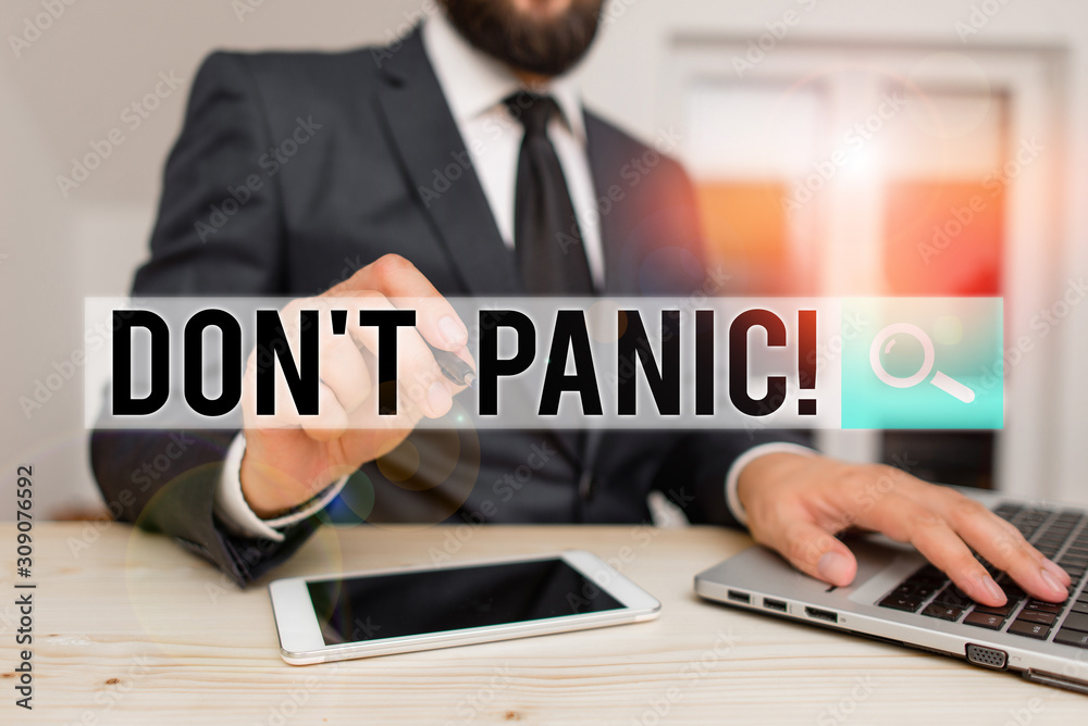 Obraz premium Word writing text Don T Panic. Business photo showcasing suddenly feel so worried or frightened that you can not behave Male human wear formal clothes present presentation use hi tech smartphone