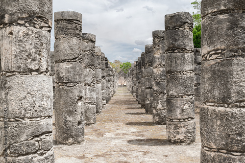Thousand columns structure - Mayan ruins featuring carved pillars at Chichen Itza archaeological site.