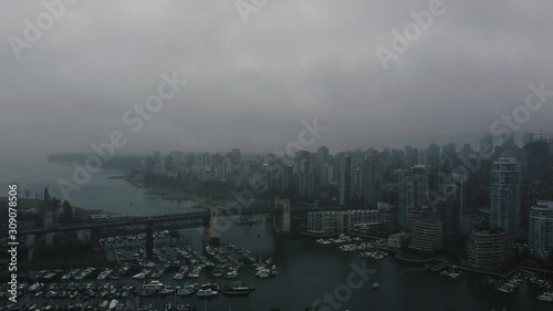 Establishing aerial view of Burrard Bridge with the West Vancouver on the background.