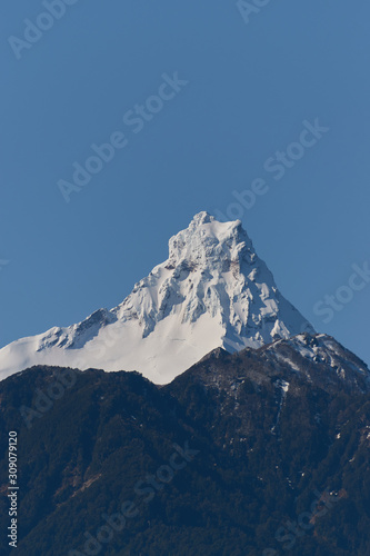 The Puntiagudo volcano seen from Petrohue near Puerto Varas in South Chile. Nature and blue sky. © Alex
