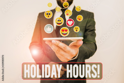Writing note showing Holiday Hours. Business concept for Overtime work on for employees under flexible work schedules