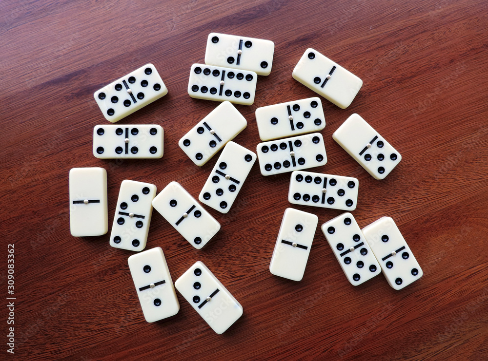 A set of Domino pieces on the wooden table A set of Domino pieces on the wooden table