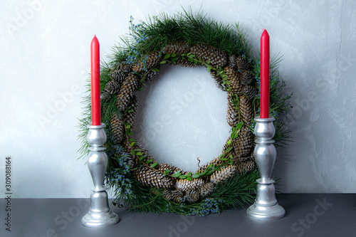 Handmade wreath with semens and candles photo