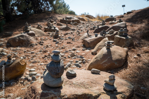 stacked stones along a rock trail  