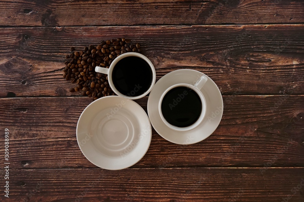 cup of coffee on wooden table cup of coffee on wooden table
