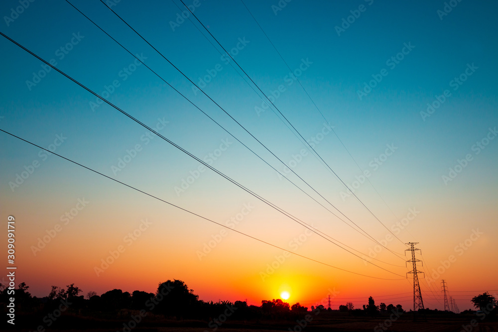 High voltage power transmission line On the beautiful sunset sky background