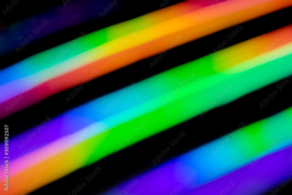 Holographic background with different colors. Holographic lines on black background. Neon line. Holographic background with different colors. Holographic lines on black background. Neon line.