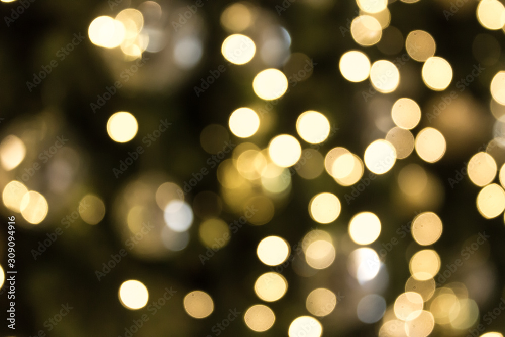 Christmas with gold bokeh light background. Xmas abstract blur and glowing decorations outdoors. Christmas with gold bokeh light background. Xmas abstract blur and glowing decorations outdoors.