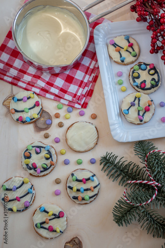 Traditional home made Christmas Lights Cookies on a festive christmas background