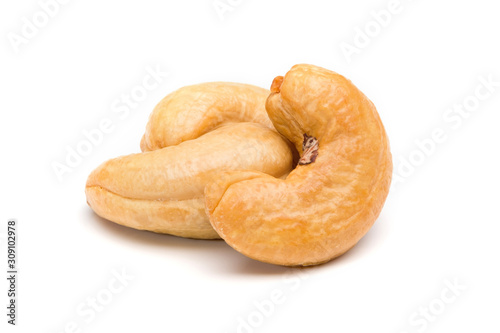 Cashews nuts stacked on white background.