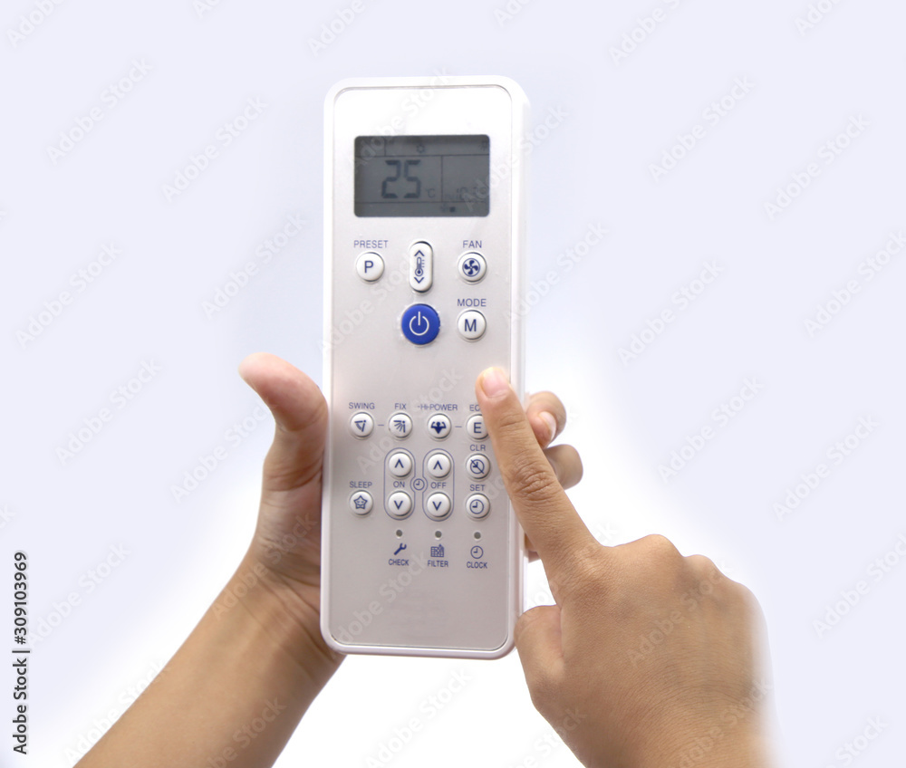Hand holding air conditioner remote control on white background Hand holding air conditioner remote control on white background
