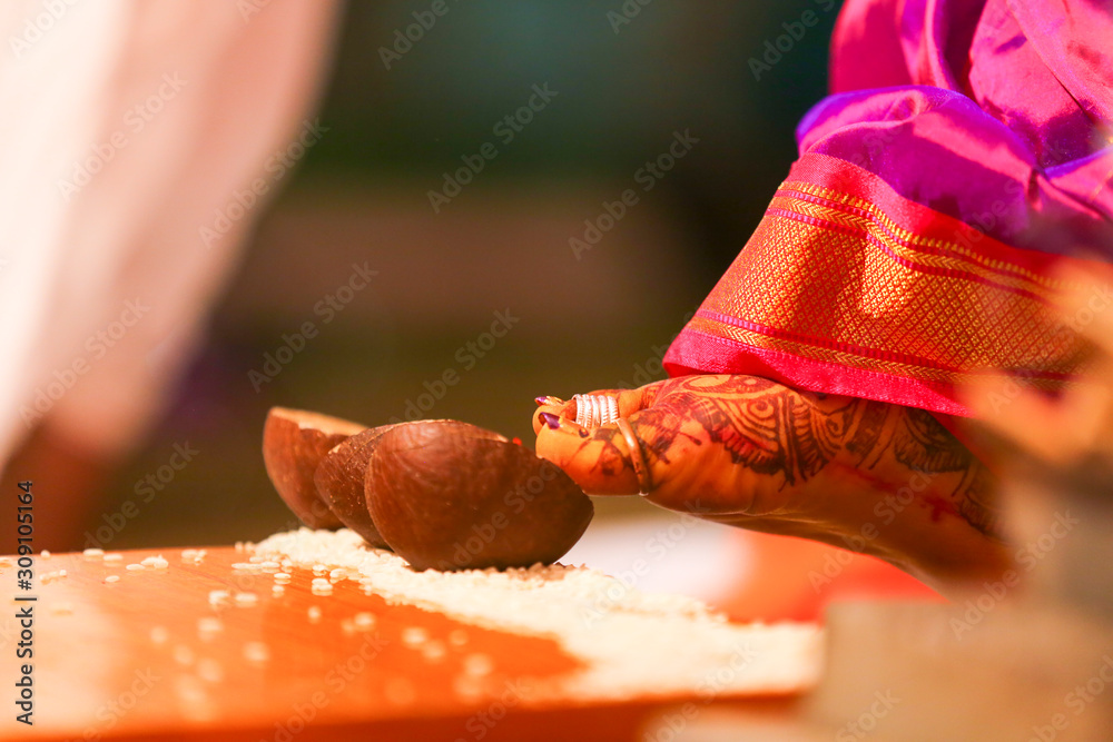 Indian wedding ceremony :Decorative wooden board with rice grain and coconut for haldi ceremony Indian wedding ceremony :Decorative wooden board with rice grain and coconut for haldi ceremony