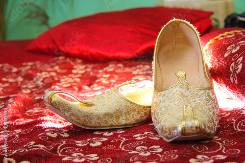 Traditional indian wedding ceremony : Grooms shoes photo