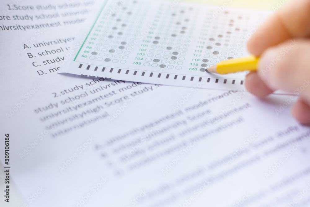 high school,university student study.hands holding pencil writing paper answer sheet.sitting lecture chair taking final exam attending in examination classroom.concept scholarship for education abroad high school,university student study.hands holding pencil writing paper answer sheet.sitting lecture chair taking final exam attending in examination classroom.concept scholarship for education abroad