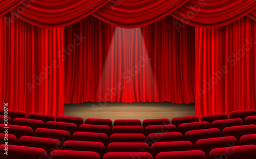 red chairs and red curtain on the stage in the hall